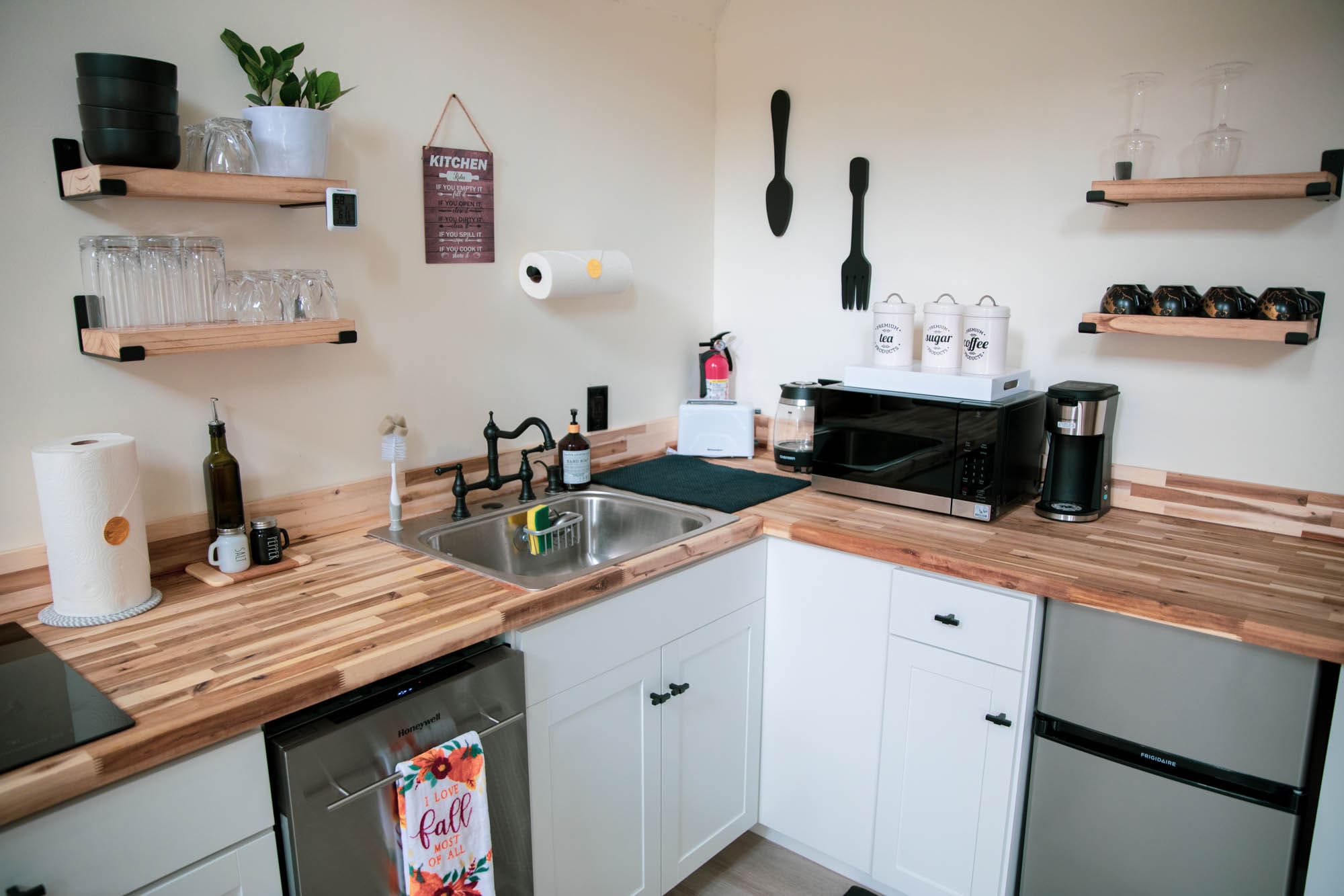 Stocked coffee bar with vintage tea, sugar, and coffee canisters